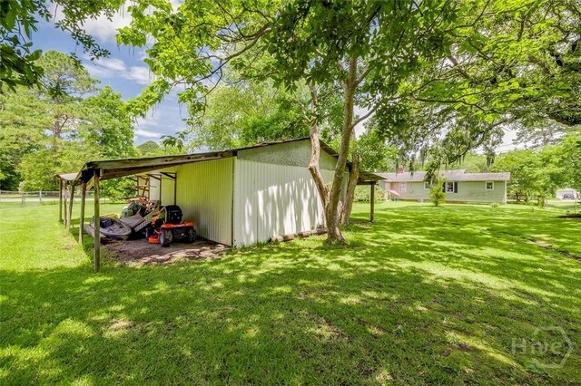 149 Spruce St, Richmond Hill, GA 31324 - view of yard with an outbuilding