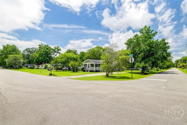 149 Spruce St, Richmond Hill, GA 31324 - view of asphalt street with traffic signs