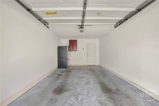 411 Southbridge Blvd Unit 706, Savannah, GA 31405 - garage with freestanding refrigerator and a garage door opener