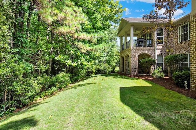 411 Southbridge Blvd Unit 706, Savannah, GA 31405 - view of grassy yard with a balcony
