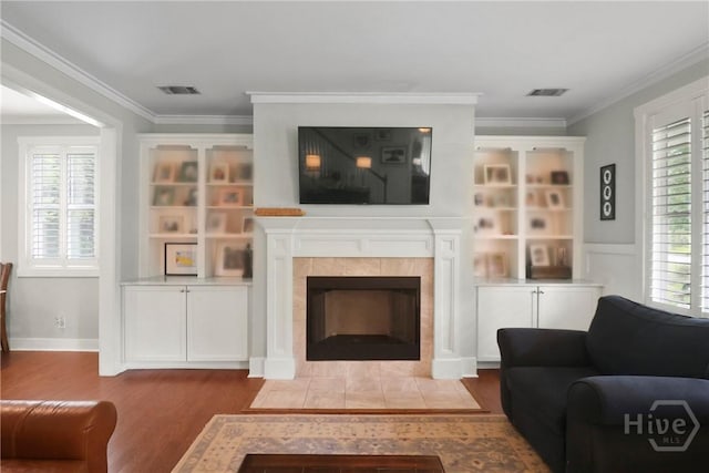 49 Tidewater Rd, Savannah, GA 31406 - living area with wood finished floors, a fireplace, and ornamental molding