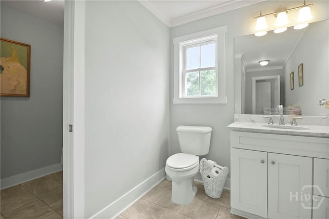 49 Tidewater Rd, Savannah, GA 31406 - bathroom with crown molding, vanity, toilet, baseboards, and tile patterned floors