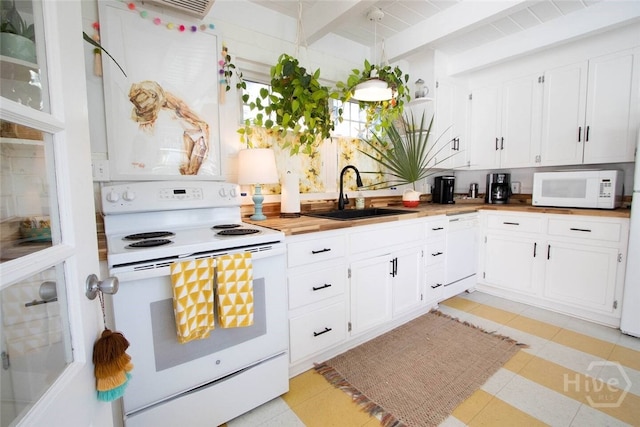 1017 Lovell Ave, Tybee Island, GA 31328 - kitchen with white appliances, beamed ceiling, open shelves, and white cabinets