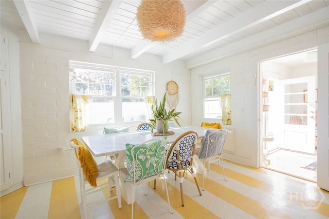 1017 Lovell Ave, Tybee Island, GA 31328 - dining area with beamed ceiling and light flooring
