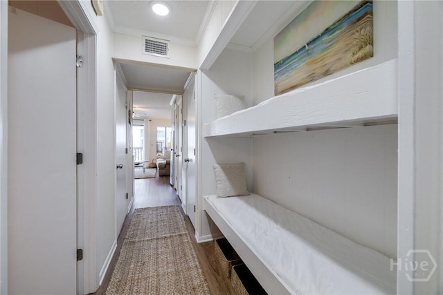1217 Bay St Unit 105A, Tybee Island, GA 31328 - corridor with ornamental molding and dark wood finished floors