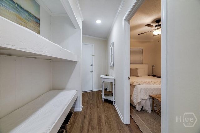 1217 Bay St Unit 105A, Tybee Island, GA 31328 - bedroom featuring crown molding, dark wood-type flooring, and ceiling fan