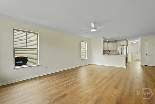 3 Chandler Bluff Dr, Savannah, GA 31407 - unfurnished living room with crown molding, a ceiling fan, light wood-style floors, and recessed lighting