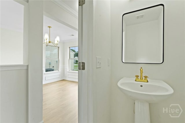 3 Chandler Bluff Dr, Savannah, GA 31407 - bathroom with a chandelier and wood finished floors
