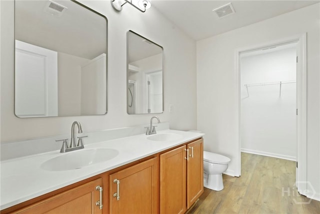 3 Chandler Bluff Dr, Savannah, GA 31407 - full bathroom featuring double vanity, wood finished floors, and a spacious closet