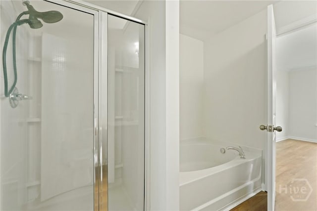 3 Chandler Bluff Dr, Savannah, GA 31407 - full bathroom featuring a stall shower, a bath, and wood finished floors
