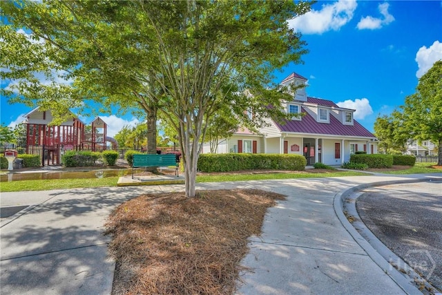 3 Chandler Bluff Dr, Savannah, GA 31407 - cape cod-style house featuring a metal roof and covered porch