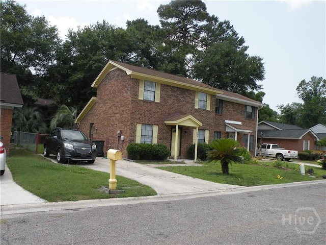 123 Hunt Club Ct, Savannah, GA 31406 - view of front of property featuring driveway, a front lawn, and brick siding