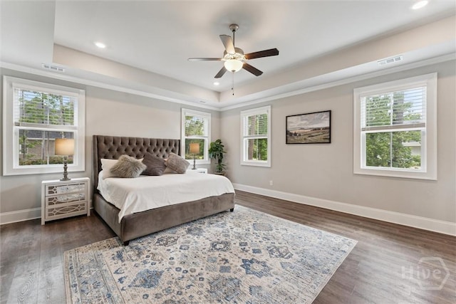 117 Oakcrest Dr W, Savannah, GA 31405 - bedroom featuring multiple windows, a raised ceiling, dark wood-style floors, and recessed lighting