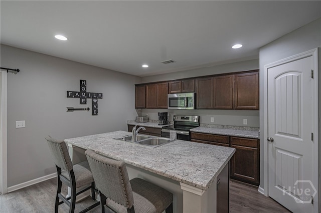 452 Keller Rd, Rincon, GA 31326 - kitchen featuring appliances with stainless steel finishes, dark wood finished floors, dark brown cabinetry, and recessed lighting