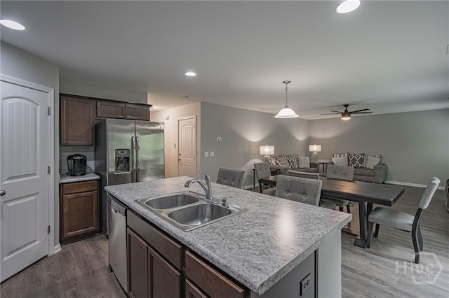 452 Keller Rd, Rincon, GA 31326 - kitchen with appliances with stainless steel finishes, a ceiling fan, wood finished floors, hanging light fixtures, and light countertops
