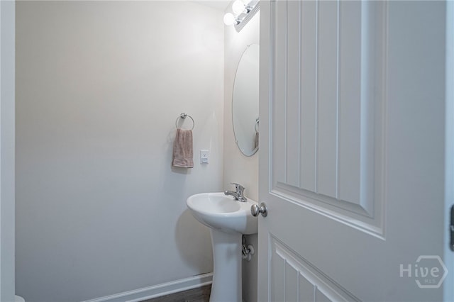 452 Keller Rd, Rincon, GA 31326 - half bathroom with baseboards and a sink
