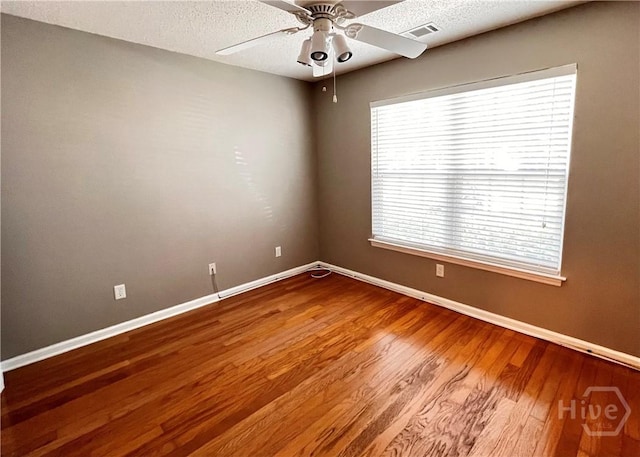 122 River Pointe Dr, Savannah, GA 31410 - spare room with ceiling fan, wood finished floors, and a textured ceiling