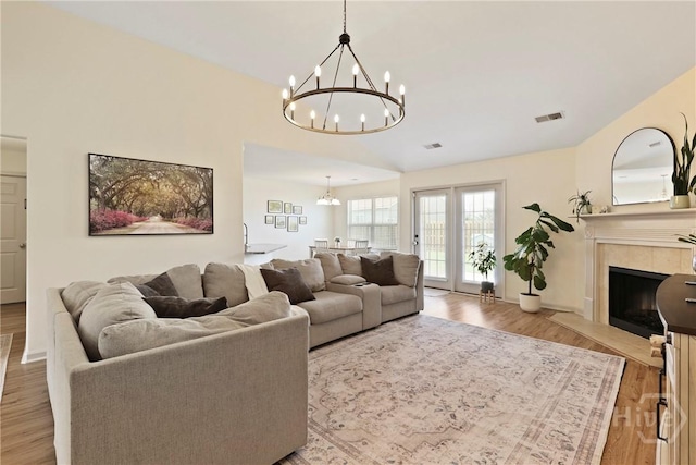 175 Willow Point Cir, Savannah, GA 31407 - living area featuring a chandelier, wood finished floors, and a fireplace