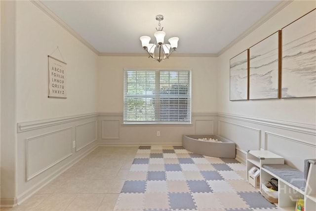 175 Willow Point Cir, Savannah, GA 31407 - unfurnished dining area featuring a chandelier, light tile patterned floors, a decorative wall, wainscoting, and ornamental molding