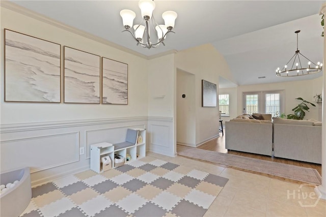 175 Willow Point Cir, Savannah, GA 31407 - tiled dining space featuring a chandelier, wainscoting, and lofted ceiling