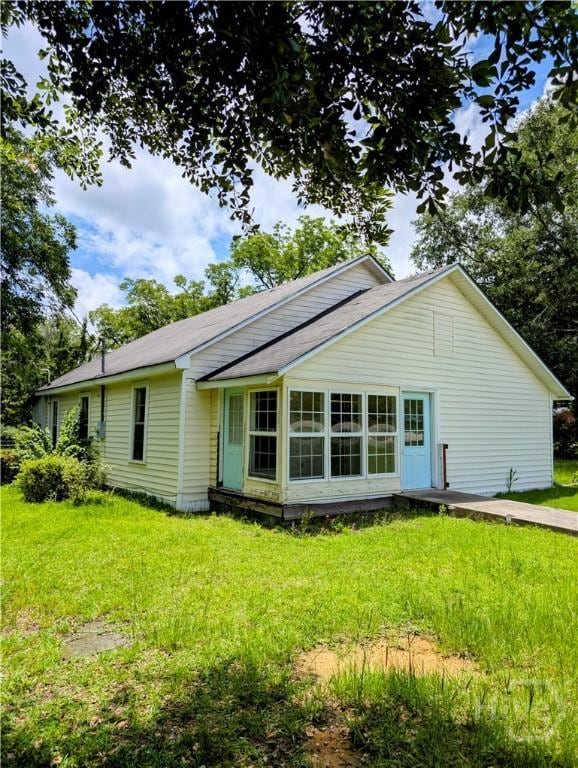 912 5th Ave, Twin City, GA 30471 - back of house with a lawn