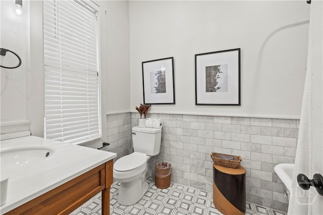1212 Price St, Savannah, GA 31401 - full bath featuring tile walls, wainscoting, and vanity