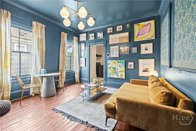 1212 Price St, Savannah, GA 31401 - living area featuring a chandelier, ornamental molding, and wood-type flooring