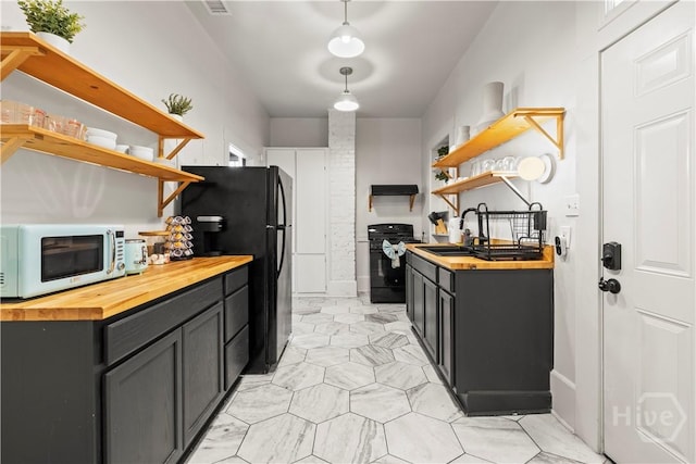 1212 Price St, Savannah, GA 31401 - kitchen featuring wooden counters, open shelves, and black appliances