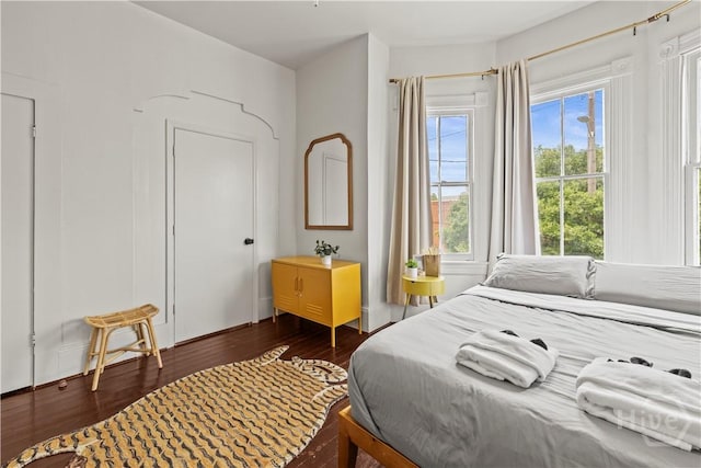 1212 Price St, Savannah, GA 31401 - bedroom featuring dark wood-type flooring and multiple windows