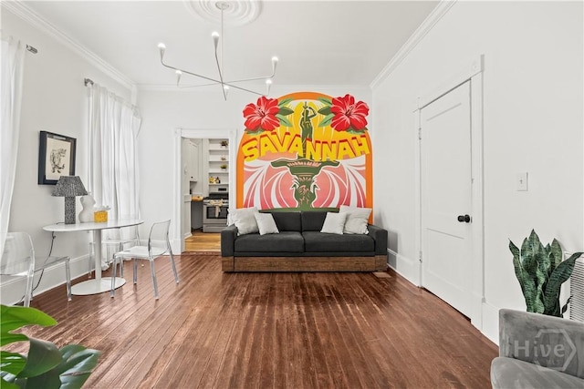 1212 Price St, Savannah, GA 31401 - sitting room with crown molding, wood finished floors, and a chandelier