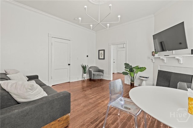 1212 Price St, Savannah, GA 31401 - living area with a chandelier, crown molding, a fireplace, and wood finished floors