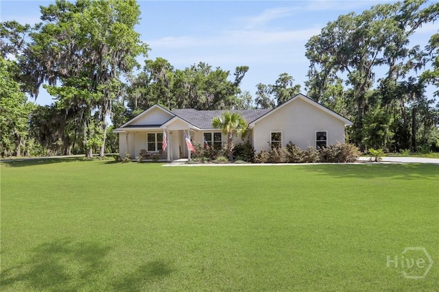 1003 Dolphin Ct, Townsend, GA 31331 - ranch-style home featuring a front lawn and stucco siding