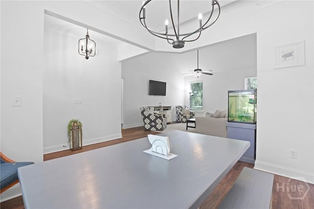 1003 Dolphin Ct, Townsend, GA 31331 - dining room featuring a chandelier, dark wood-style flooring, and a ceiling fan
