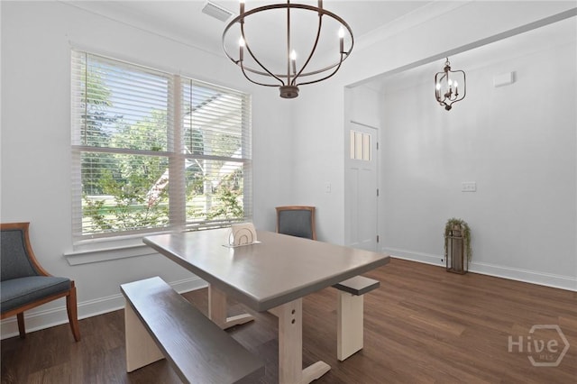 1003 Dolphin Ct, Townsend, GA 31331 - dining space featuring a chandelier, plenty of natural light, and dark wood finished floors