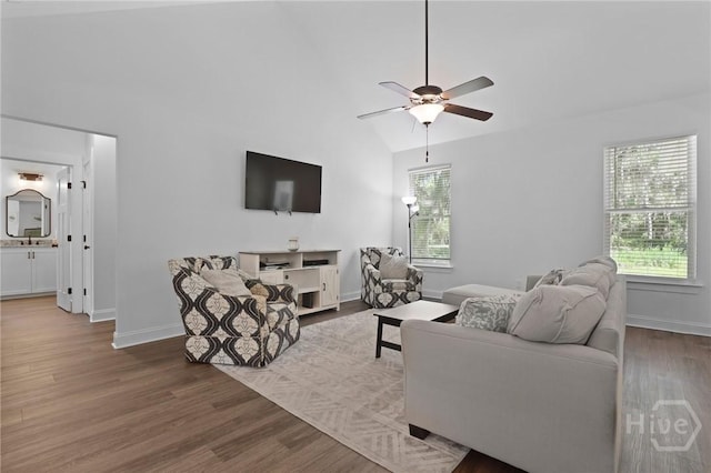 1003 Dolphin Ct, Townsend, GA 31331 - living area with healthy amount of natural light, wood finished floors, ceiling fan, and vaulted ceiling