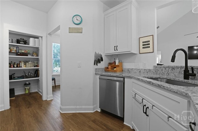 1003 Dolphin Ct, Townsend, GA 31331 - kitchen featuring dishwasher, dark wood-type flooring, light stone countertops, and white cabinets