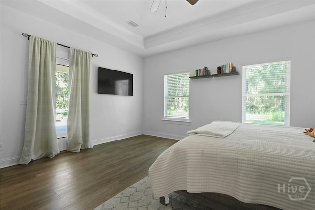 1003 Dolphin Ct, Townsend, GA 31331 - bedroom featuring multiple windows, dark wood-style floors, and a ceiling fan