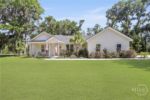 1003 Dolphin Ct, Townsend, GA 31331 - ranch-style home with a front lawn, a porch, and stucco siding