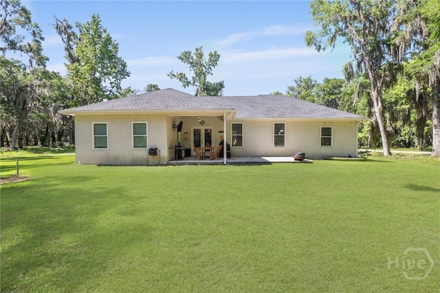 1003 Dolphin Ct, Townsend, GA 31331 - rear view of property with french doors, stucco siding, a yard, and a patio area