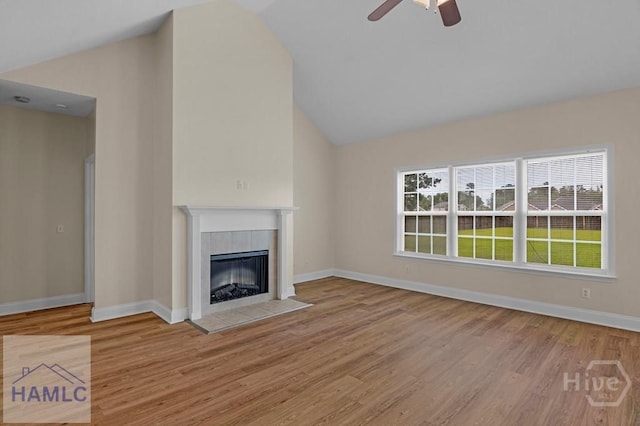 432 Cypress Creek Dr NE, Ludowici, GA 31316 - unfurnished living room with lofted ceiling, ceiling fan, wood finished floors, and a tiled fireplace