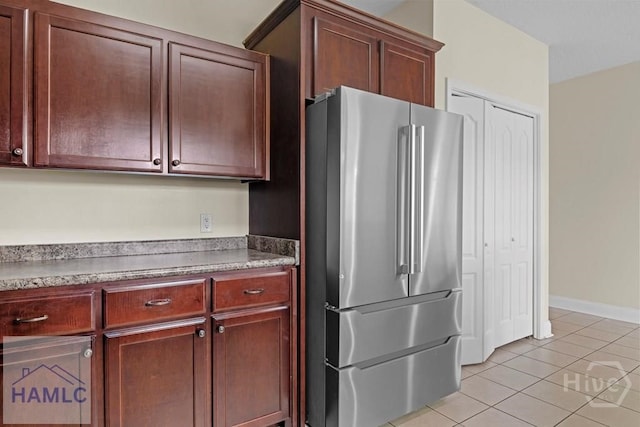 432 Cypress Creek Dr NE, Ludowici, GA 31316 - kitchen with freestanding refrigerator and light tile patterned flooring