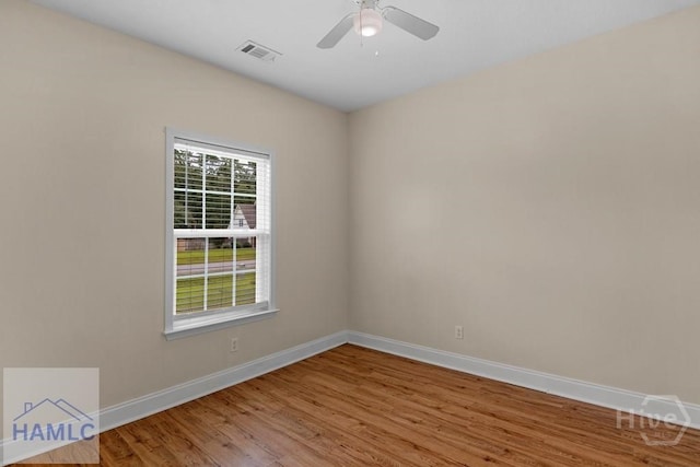 432 Cypress Creek Dr NE, Ludowici, GA 31316 - empty room with wood finished floors and ceiling fan