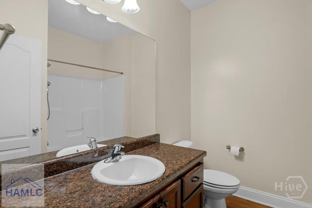 432 Cypress Creek Dr NE, Ludowici, GA 31316 - full bath featuring vanity,  shower combination, and wood finished floors