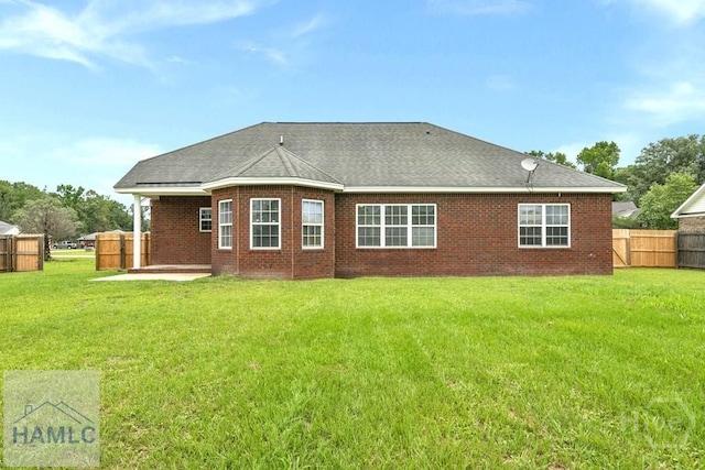 432 Cypress Creek Dr NE, Ludowici, GA 31316 - rear view of property with a patio, roof with shingles, and brick siding