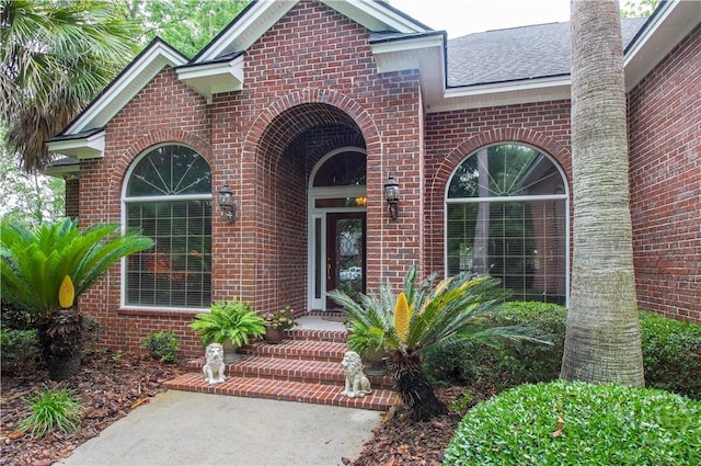 39 Grand Lake Cir, Savannah, GA 31405 - view of exterior entry featuring brick siding and a shingled roof