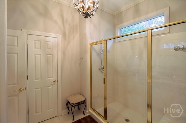 39 Grand Lake Cir, Savannah, GA 31405 - bathroom with crown molding, a stall shower, tile patterned flooring, and a chandelier