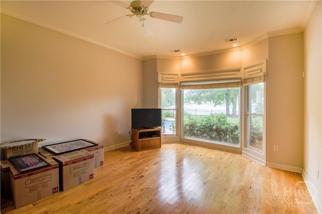 39 Grand Lake Cir, Savannah, GA 31405 - unfurnished living room featuring light wood finished floors, ornamental molding, and ceiling fan