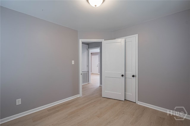 177 E Burkhalter St, Pembroke, GA 31321 - unfurnished bedroom featuring light wood finished floors and a closet