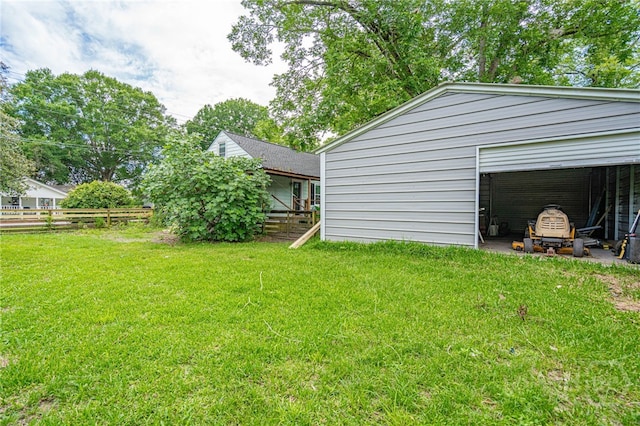 177 E Burkhalter St, Pembroke, GA 31321 - view of yard featuring an outdoor structure and a detached garage