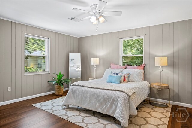 1915 Hawthorne St, Savannah, GA 31404 - bedroom with multiple windows, wood finished floors, and a ceiling fan